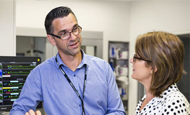 Two practitioners talking in a hospital